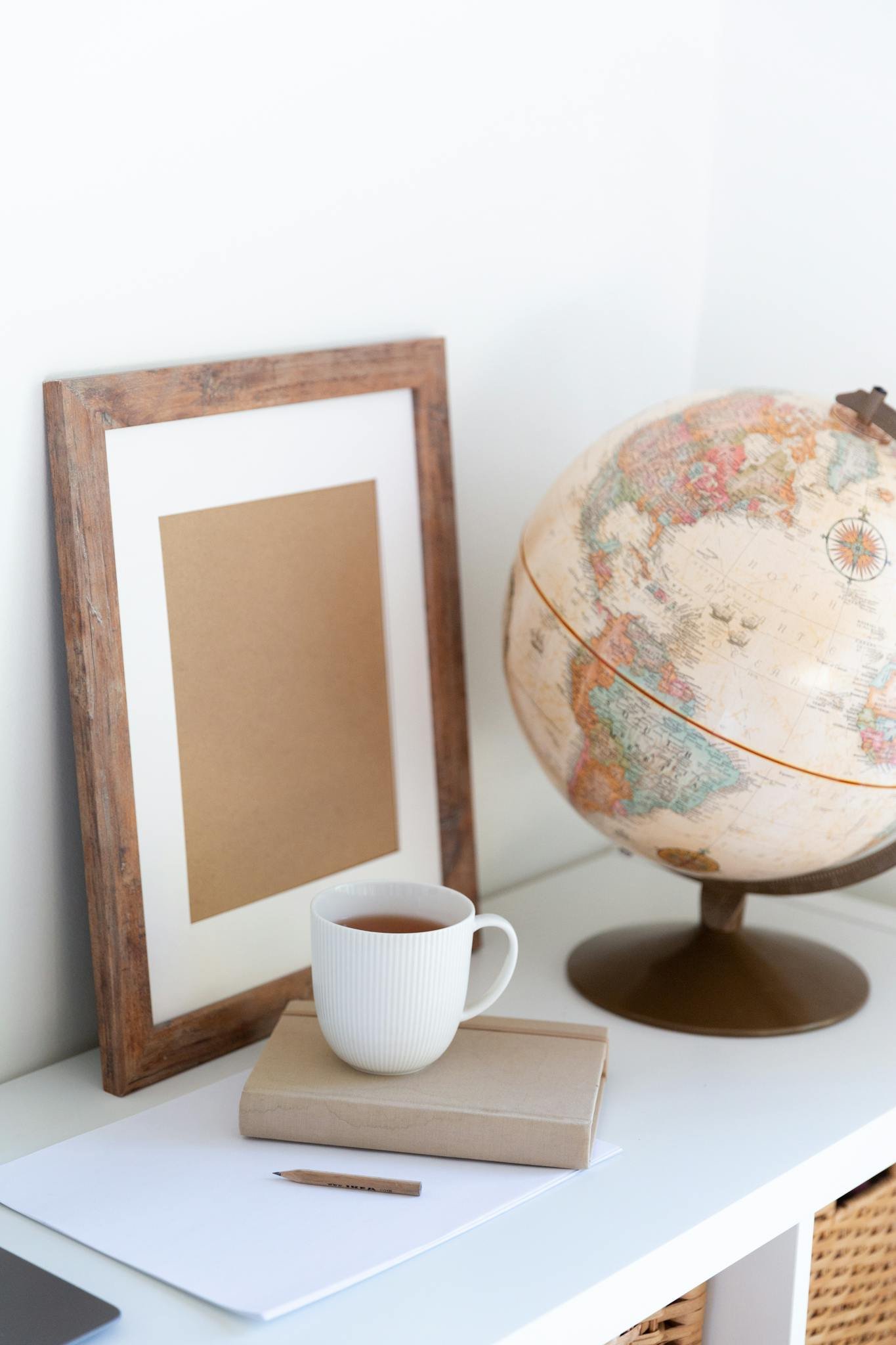 Office Equipment and furniture supplier 16 vintage globe near blank frame and cup Office Equipment and furniture supplier